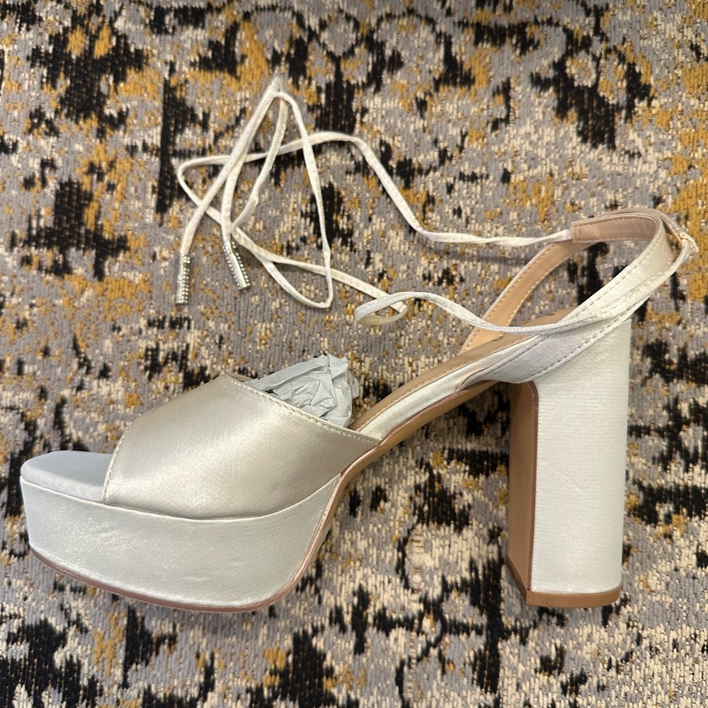 Brand new lulus, ivory block heels with tie up. Size 7.